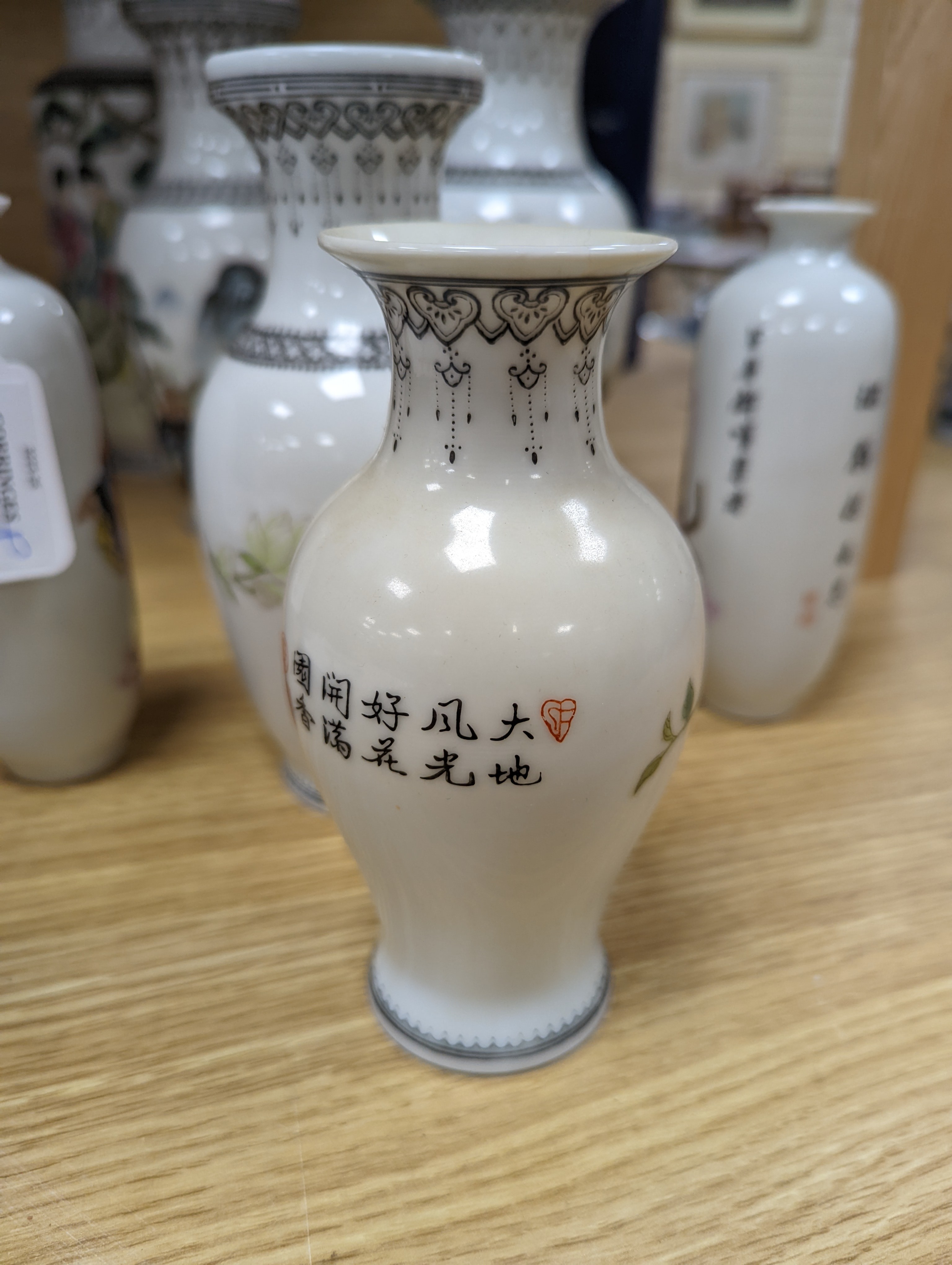 A group of seven Chinese famille rose vases, 20th century